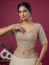 Cream silk designer embellished lehenga choli with tassel dupatta