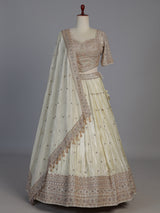 Cream silk designer embellished lehenga choli with tassel dupatta