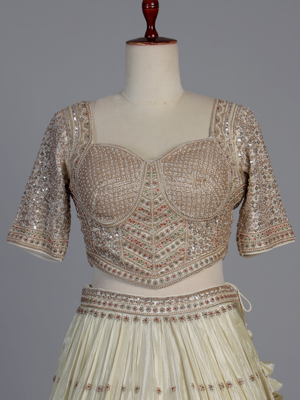 Cream silk designer embellished lehenga choli with tassel dupatta