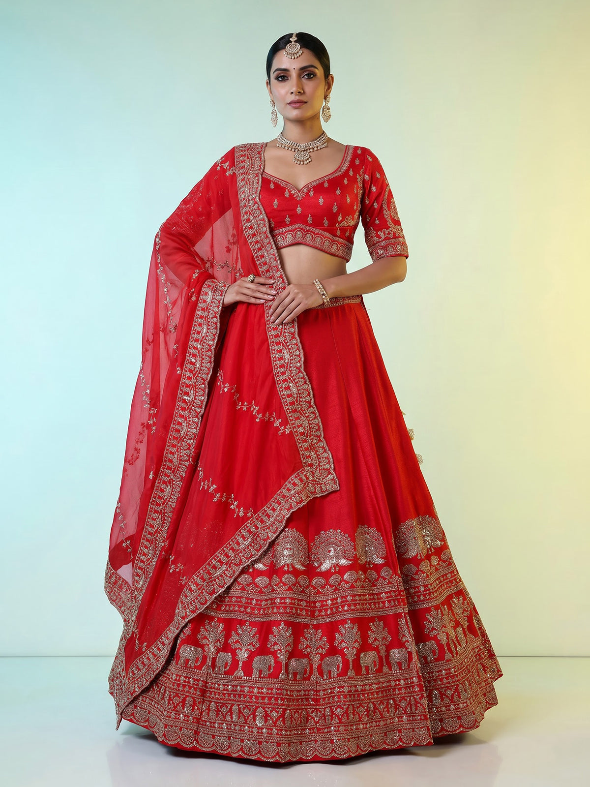 Red raw silk elephant and motif bridal lehenga choli