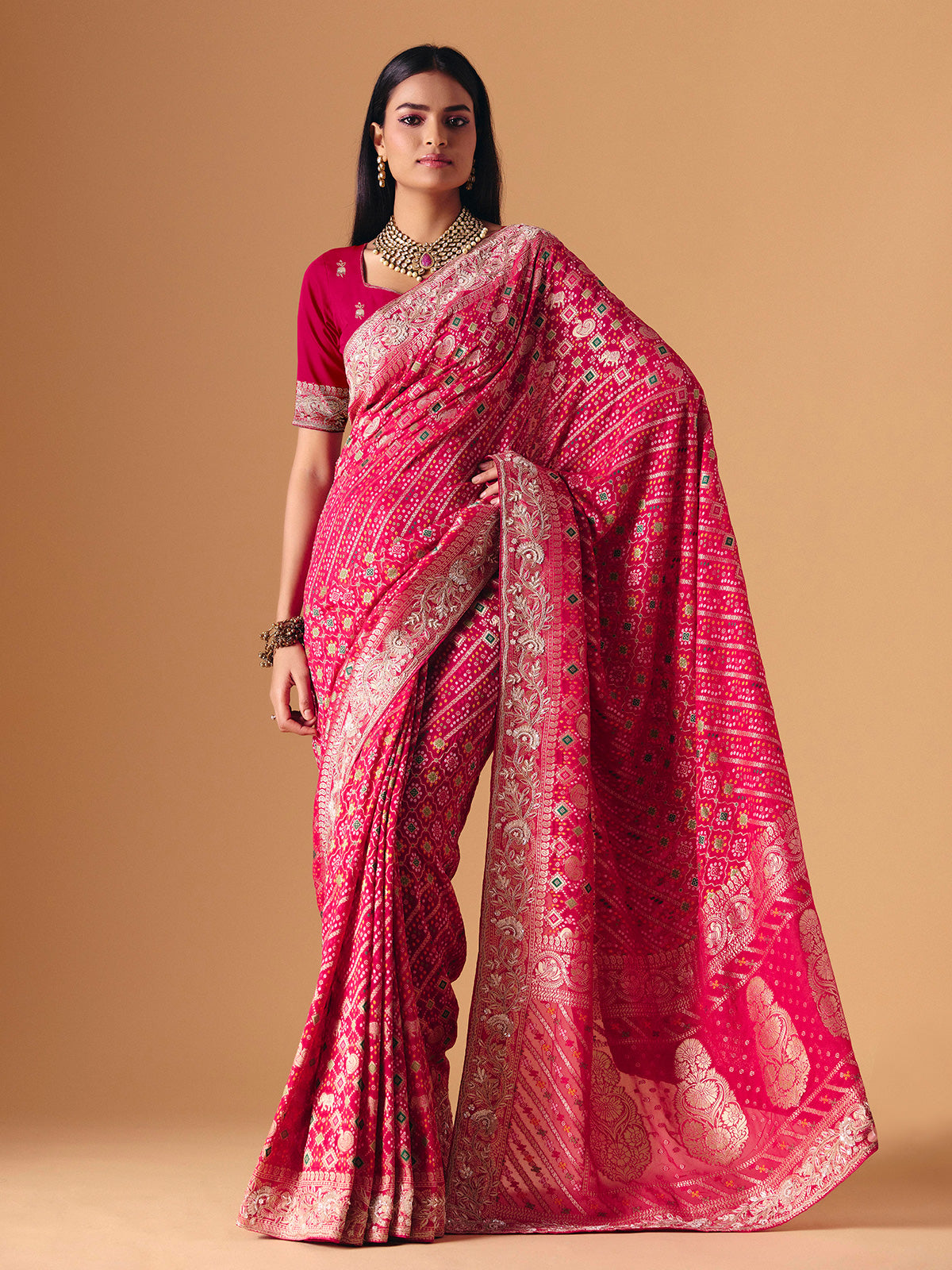 Deep pink georgette bridal saree with zardosi embellished elegance