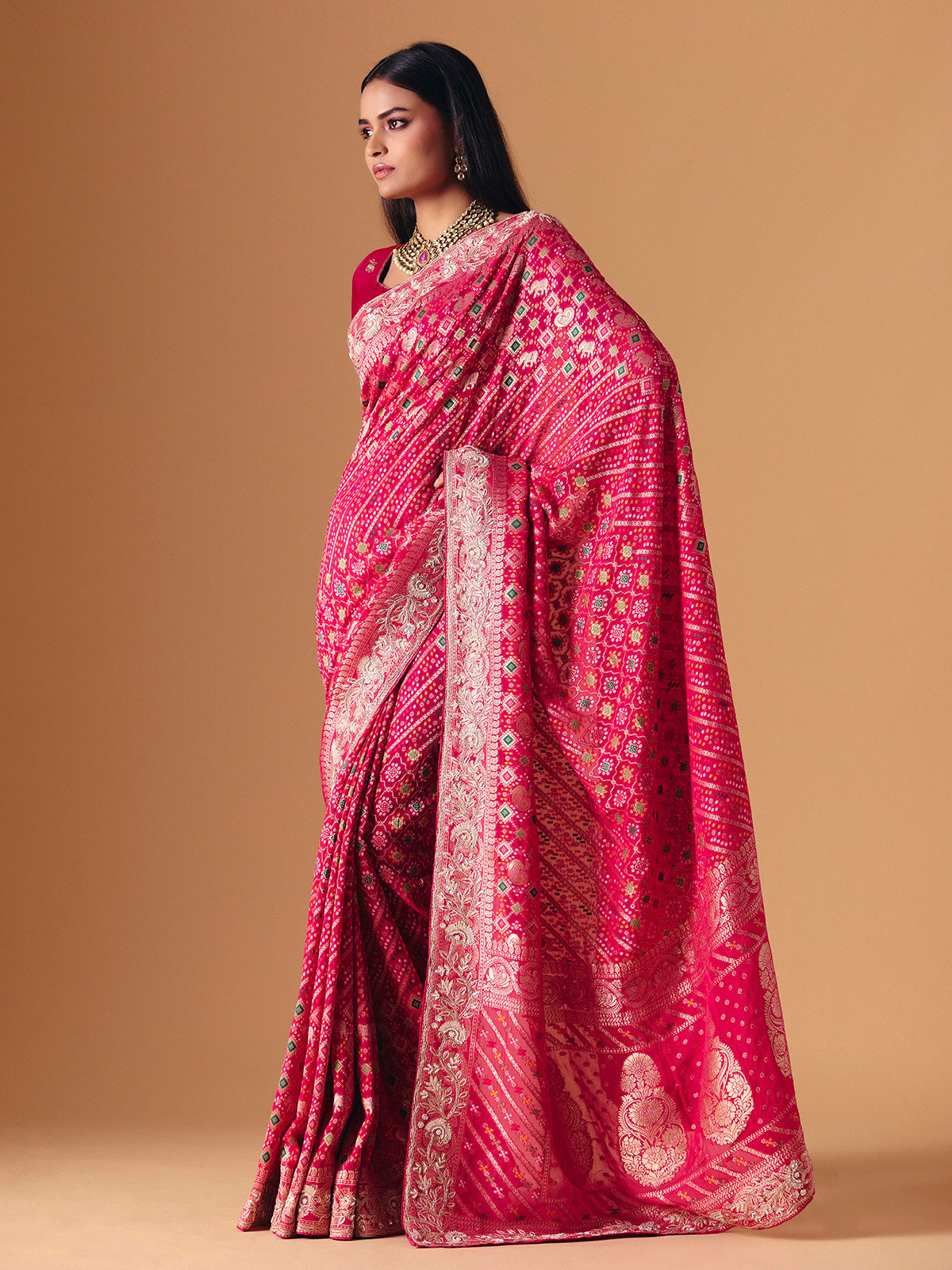 Deep pink georgette bridal saree with zardosi embellished elegance
