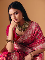 Deep pink georgette bridal saree with zardosi embellished elegance