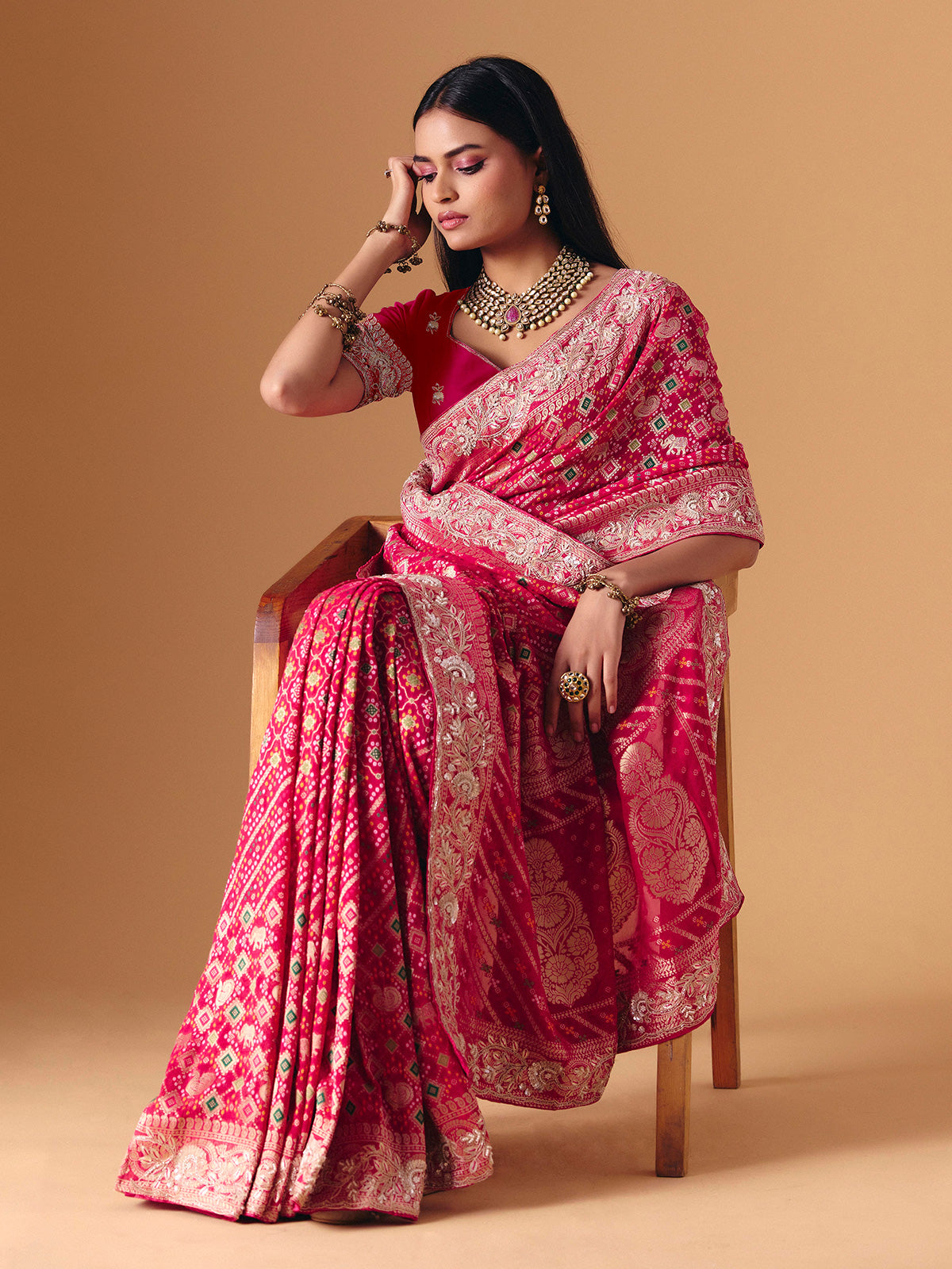 Deep pink georgette bridal saree with zardosi embellished elegance