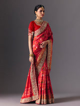 Red Hyderabadi patola silk saree with luxurious printed bridal artistry