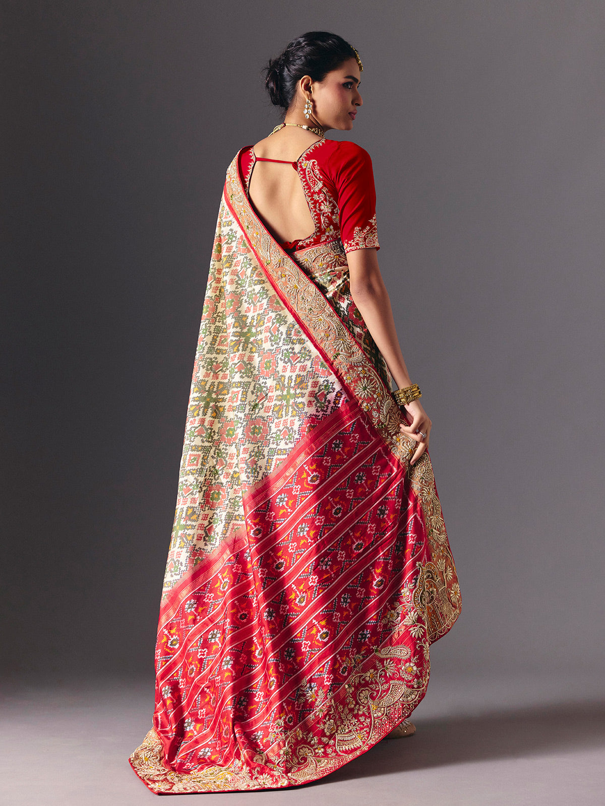 Cream Hyderabadi patola silk saree with elegant festive zari detailing