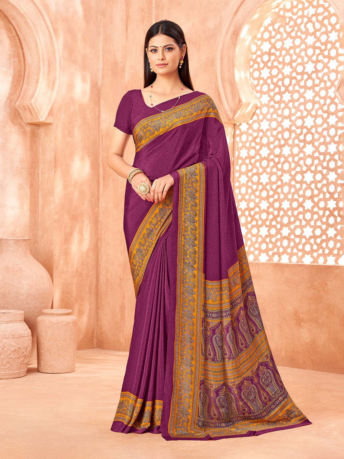Purple printed contrast border crepe silk saree