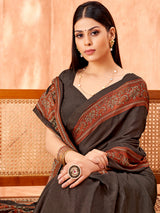 Charcoal grey contrast border crepe silk saree in printed