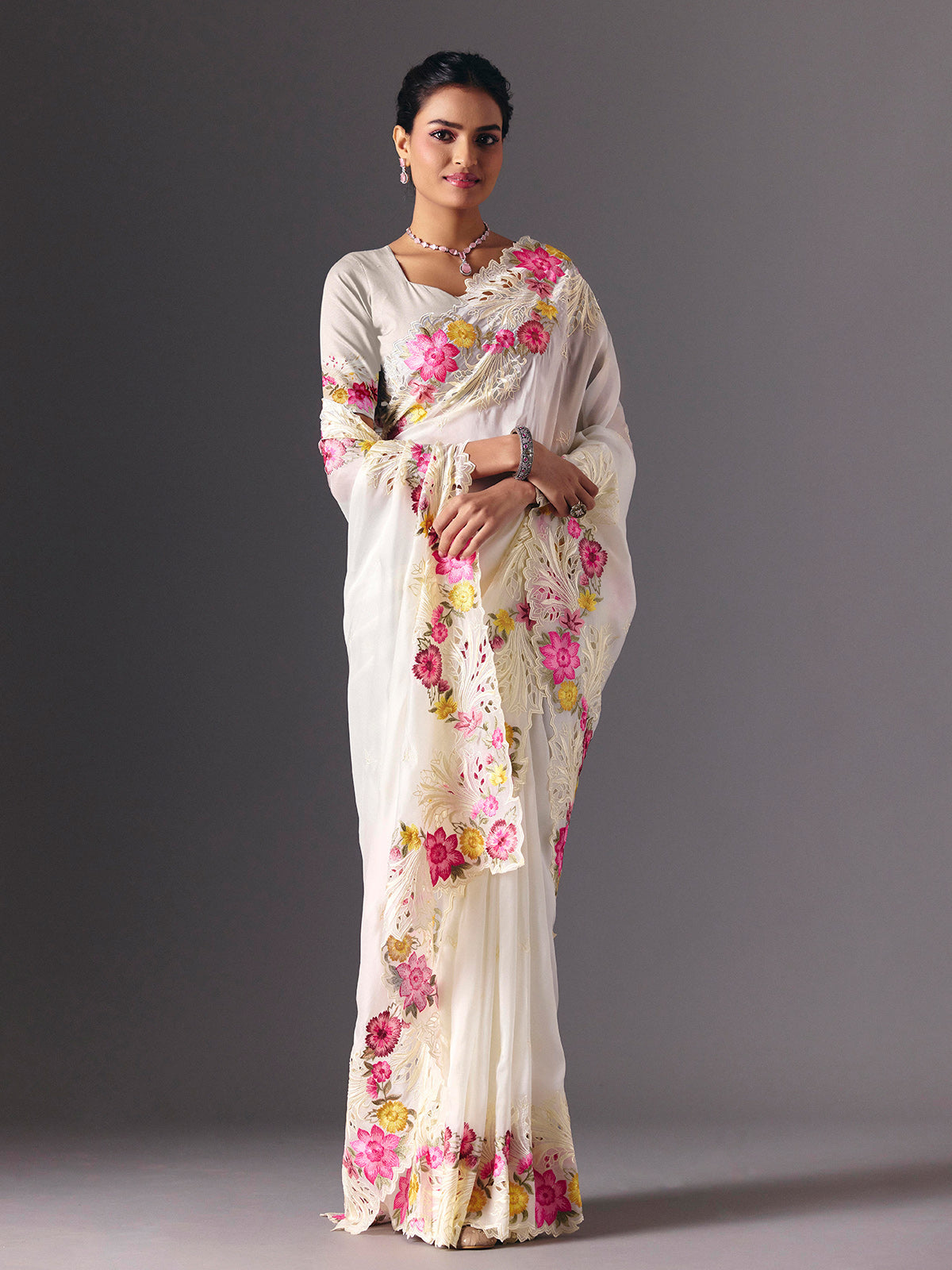 White organza floral embroidered saree with elegant cutwork detailing