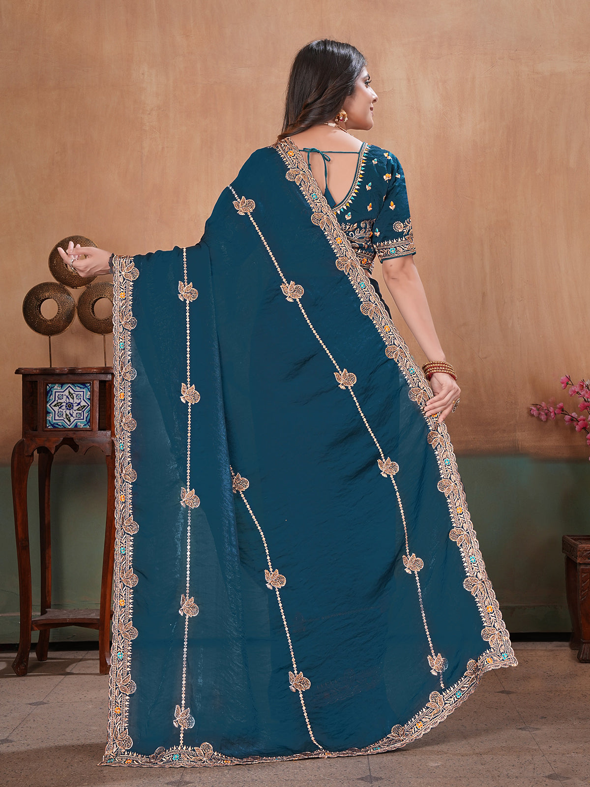 Peacock blue radiant embroidered satin saree with blouse