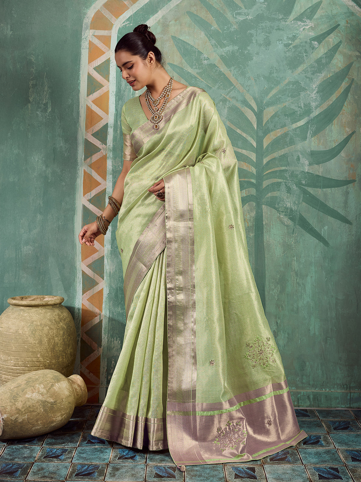 Enchanting green embroidered tissue saree for women