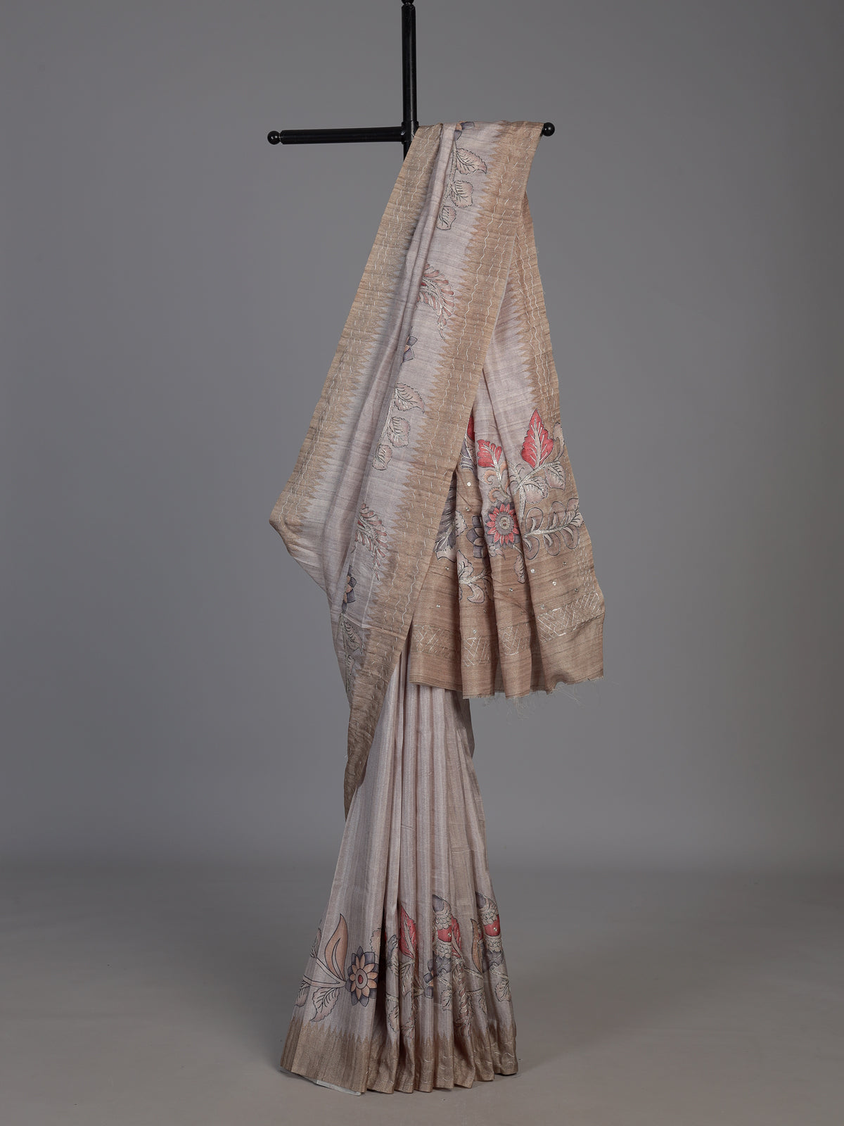 Beige art tusser silk saree with peacock floral motifs