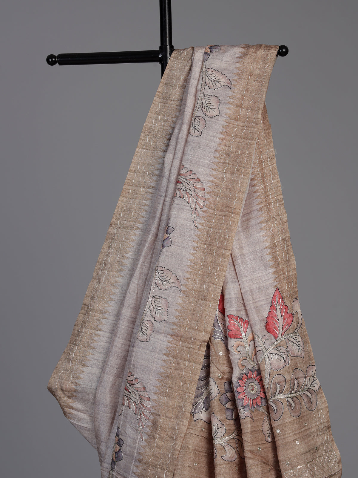 Beige art tusser silk saree with peacock floral motifs