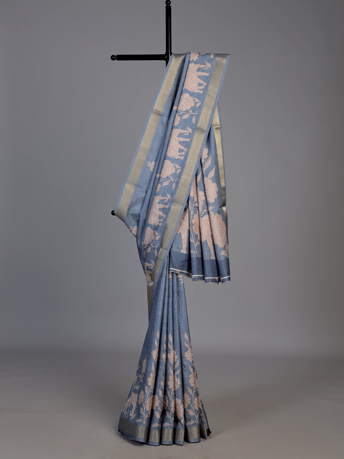 Stone blue art silk saree with floral and elephant motif detailing
