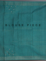 Beige tusser silk saree with regal zari border detailing