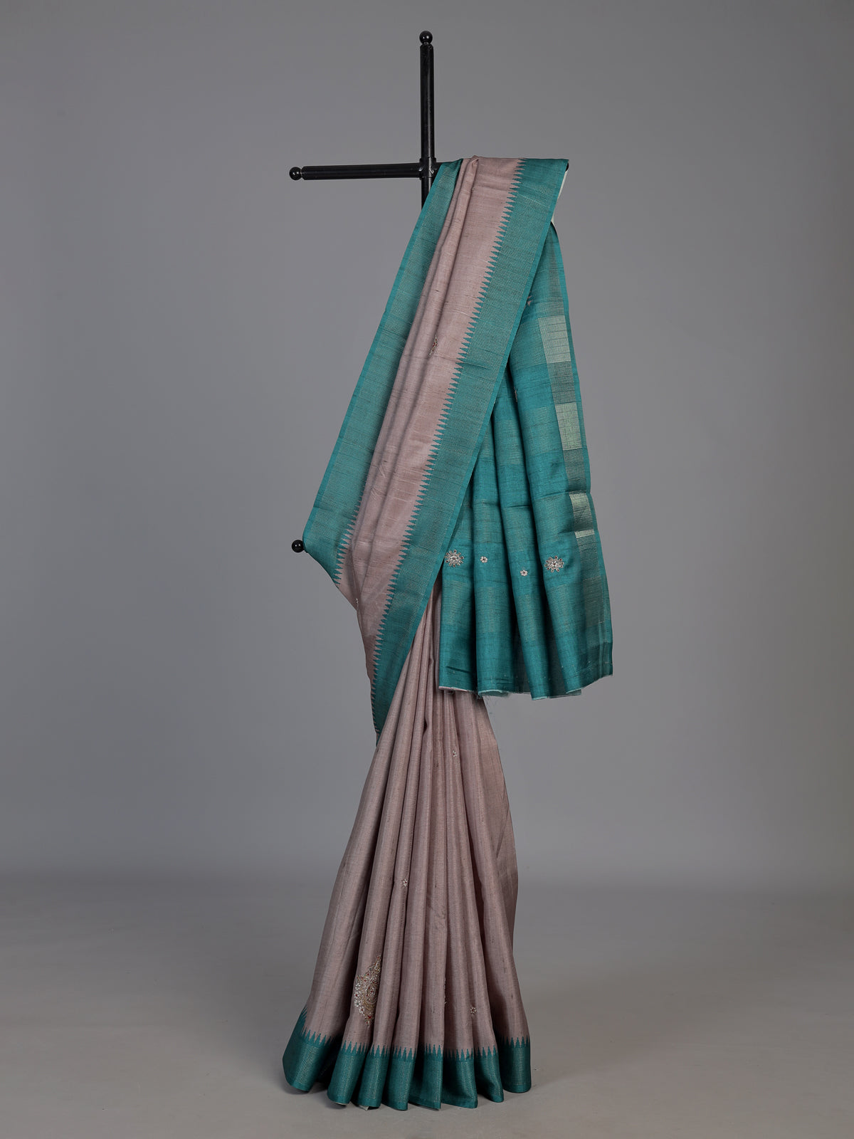 Beige tusser silk saree with regal zari border detailing