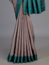 Beige tusser silk saree with regal zari border detailing