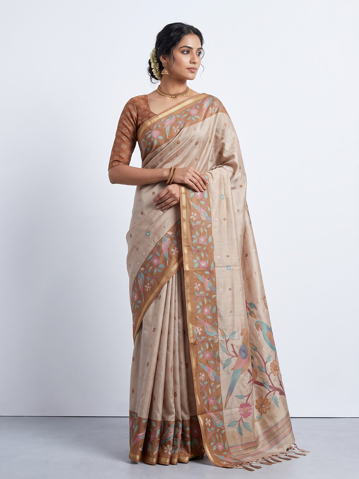 Beige and brown art tusser silk saree with floral bird detailing