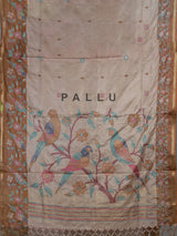 Beige and brown art tusser silk saree with floral bird detailing
