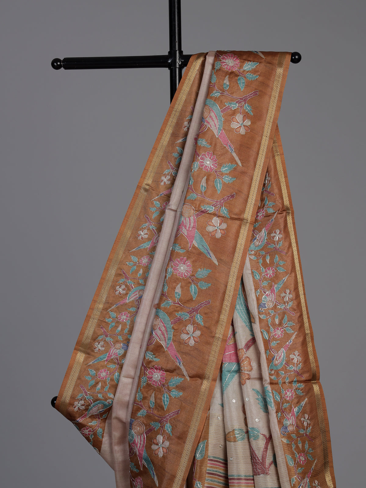Beige and brown art tusser silk saree with floral bird detailing