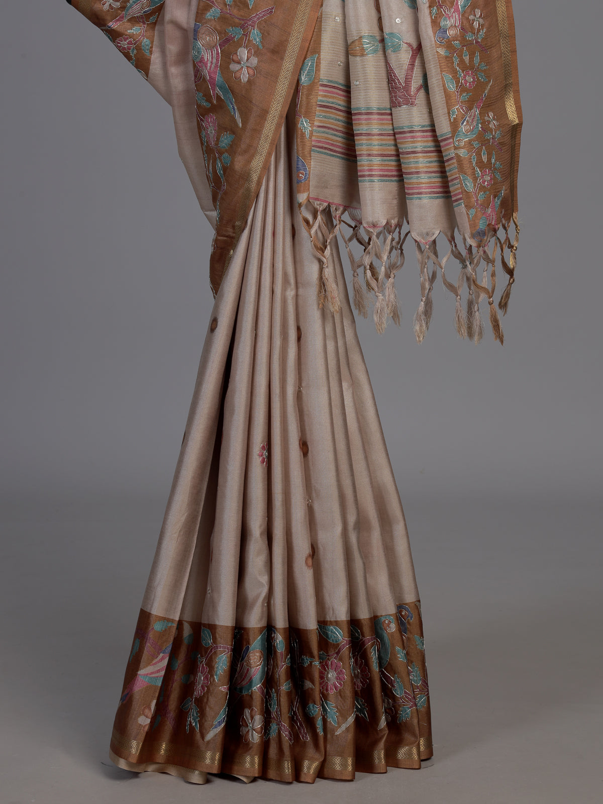 Beige and brown art tusser silk saree with floral bird detailing