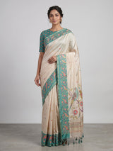 Beige and green art tusser silk saree with elegant bird motifs