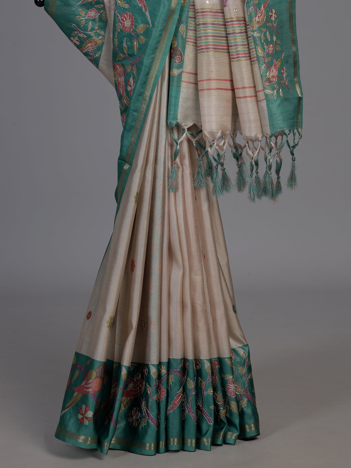 Beige and green art tusser silk saree with elegant bird motifs