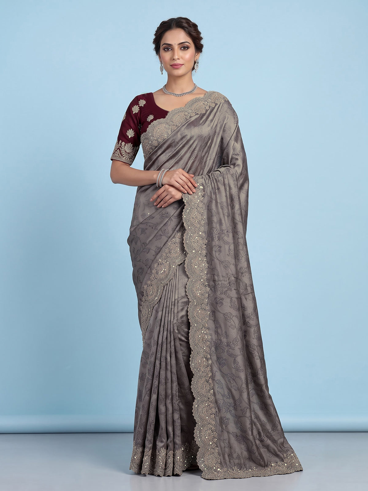 Pastel grey tissue silk saree with delicate pearl zari embellishments