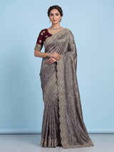 Pastel grey tissue silk saree with delicate pearl zari embellishments