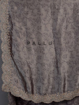 Pastel grey tissue silk saree with delicate pearl zari embellishments