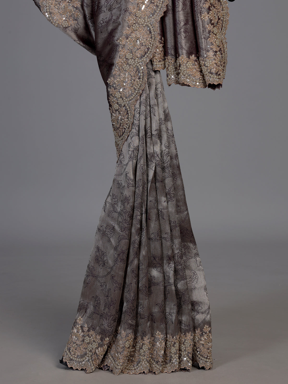 Pastel grey tissue silk saree with delicate pearl zari embellishments