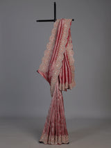Pastel rani pink tissue silk saree with luxurious zari detailing