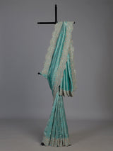 Pastel rama green tissue silk saree with elegant embellishments