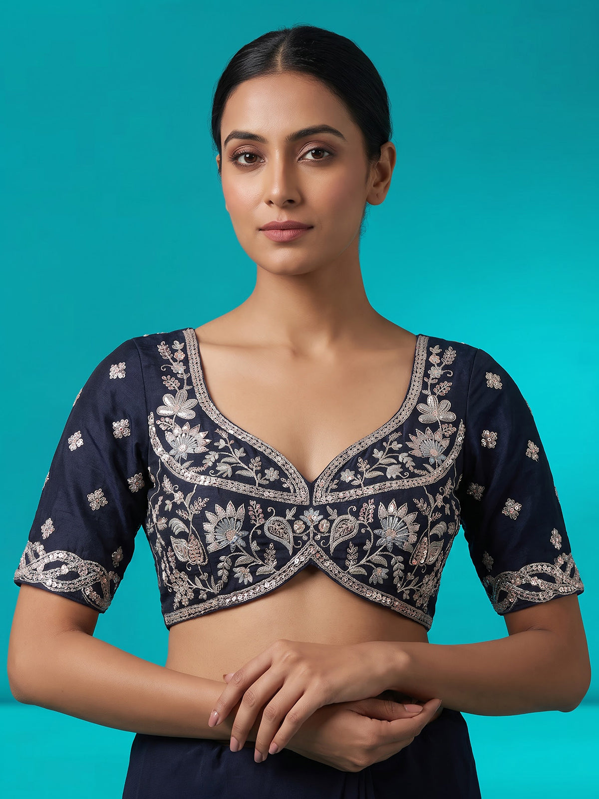 Navy blue silk lehenga choli adorned with floral stonework