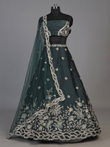 Peacock green silk lehenga choli with floral zardosi embellishments