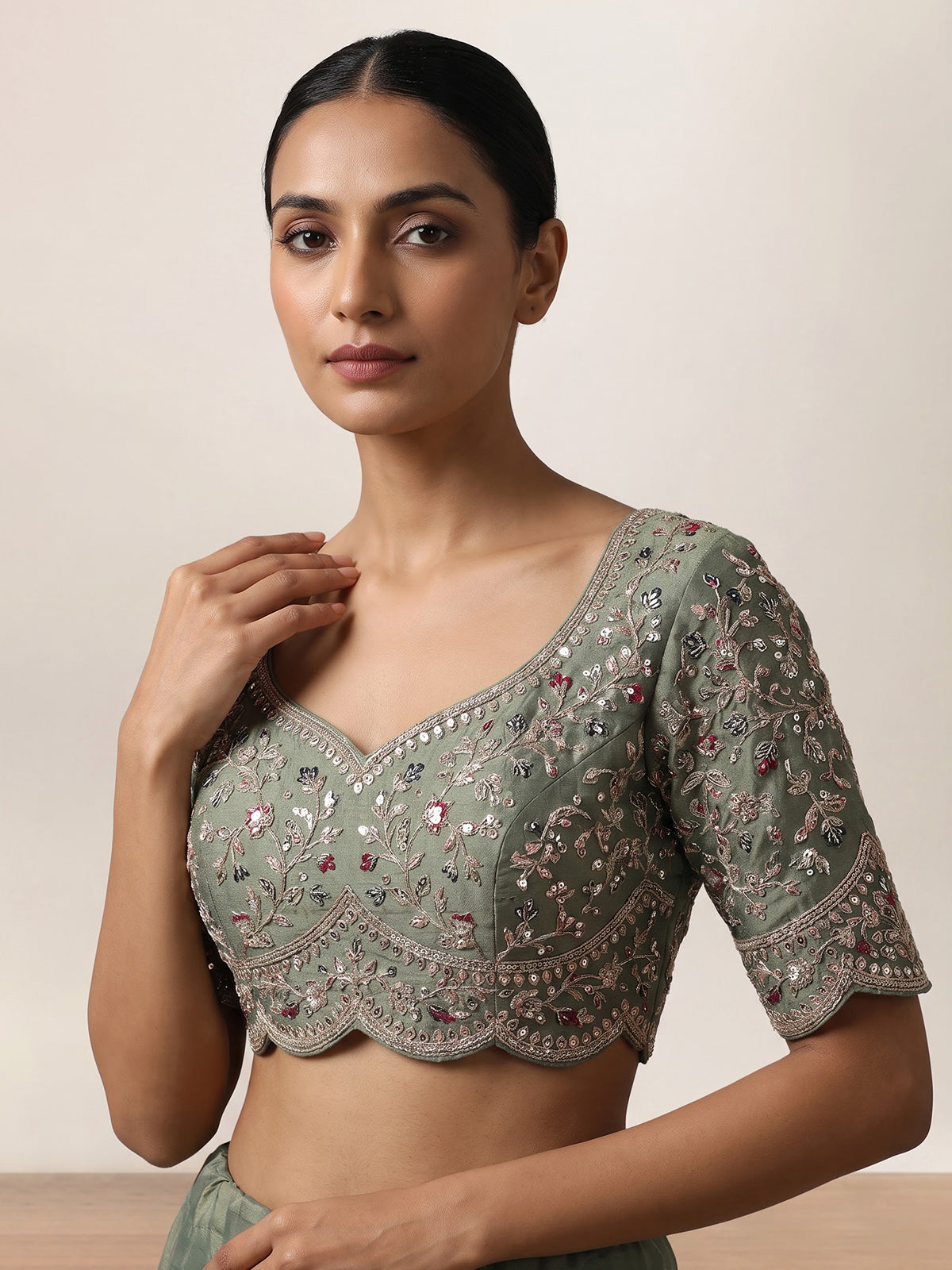 Sage green silk lehenga choli with exquisite animal artistry