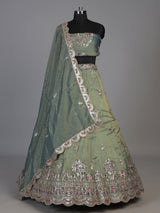 Sage green silk lehenga choli with exquisite animal artistry