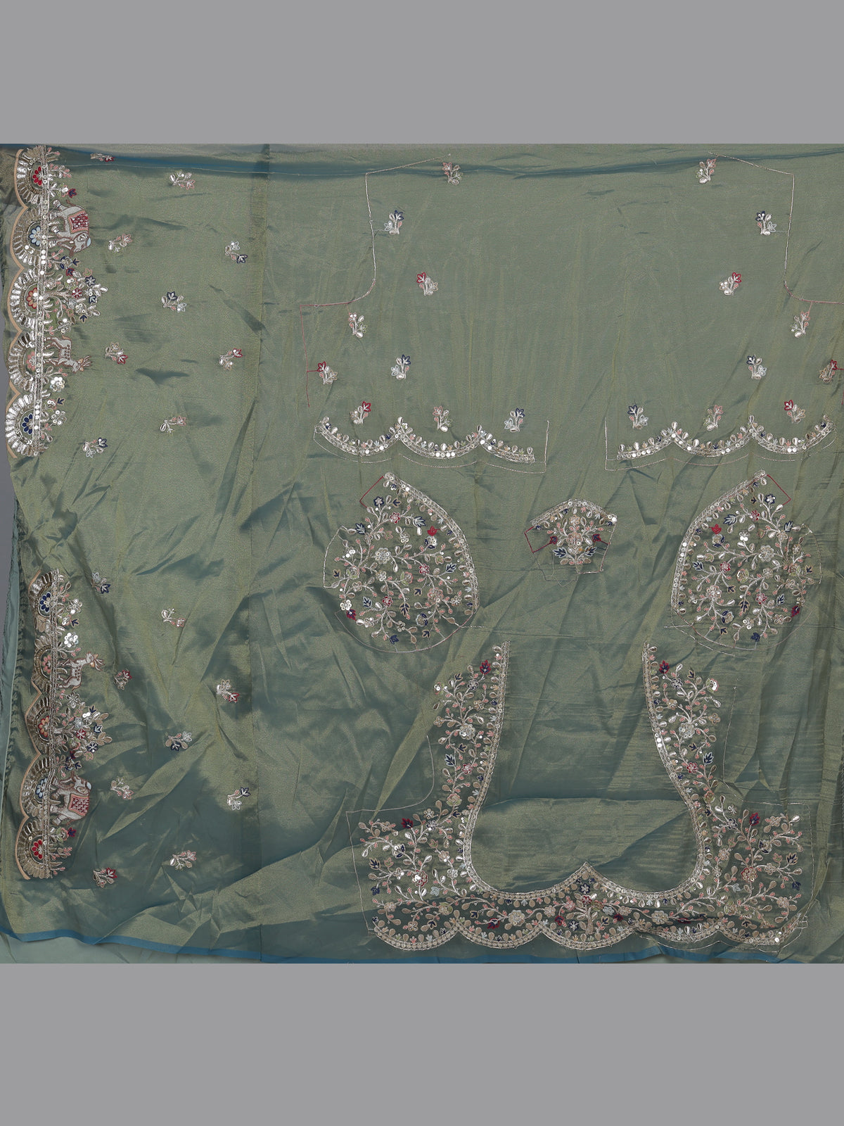 Sage green silk lehenga choli with exquisite animal artistry