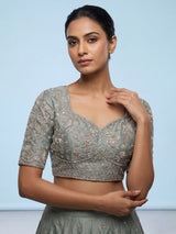 Pista green silk lehenga choli with elephant bird motifs