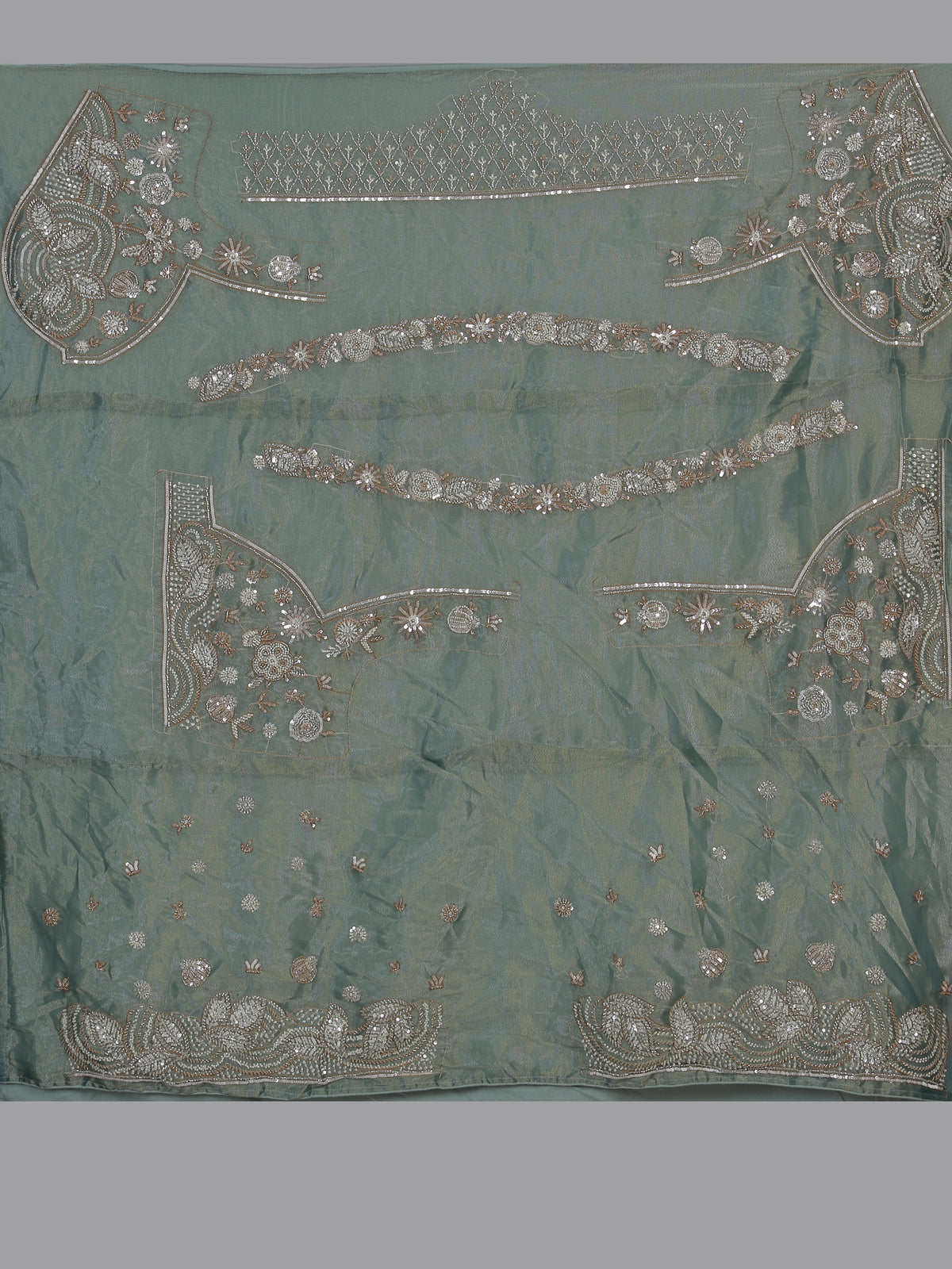 Pista green silk lehenga choli with elephant bird motifs