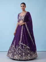 Royal purple silk lehenga choli with intricate festive craftsmanship