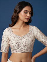 Cream silk lehenga choli decorated with charming animal motifs