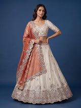 Cream silk lehenga choli decorated with charming animal motifs