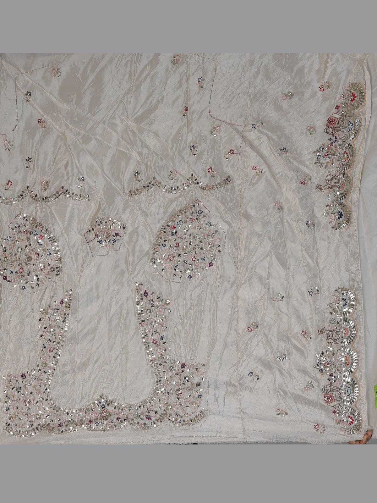 Cream silk lehenga choli decorated with charming animal motifs
