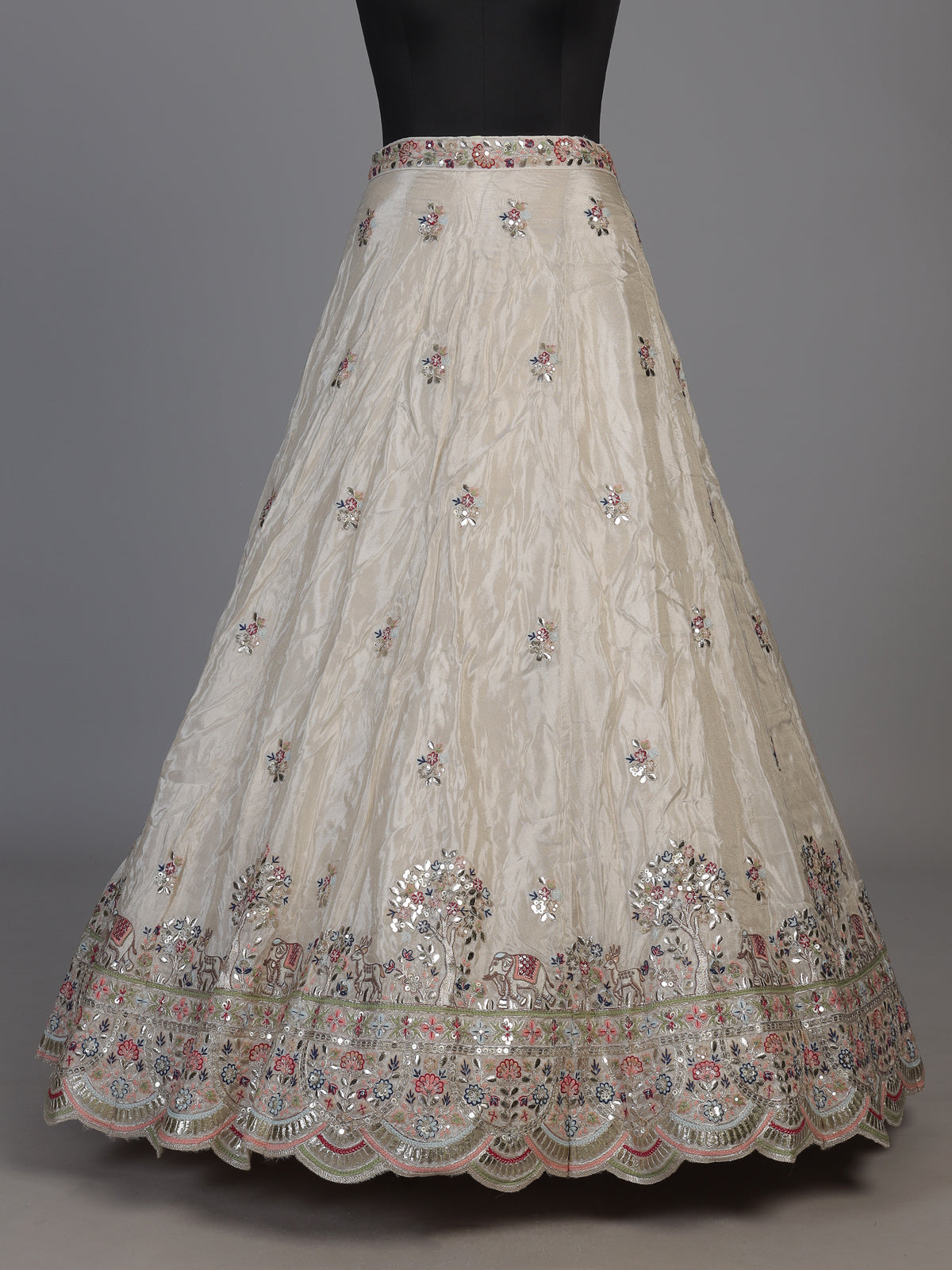 Cream silk lehenga choli decorated with charming animal motifs