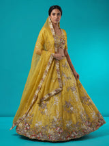 Mustard yellow tissue silk lehenga choli with dazzling embellishments