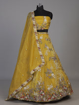 Mustard yellow tissue silk lehenga choli with dazzling embellishments
