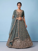 Sage green tissue silk lehenga choli with mirror accents