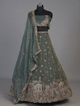 Sage green tissue silk lehenga choli with mirror accents