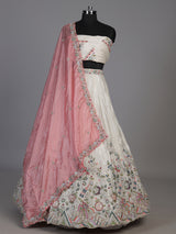 White tissue silk lehenga choli featuring exquisite zardosi embellishments